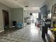 Living room with tiled floors, and view into kitchen area at 136 Madera Dr, Winter Haven, FL 33880