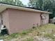 Rear view of ranch home with block exterior at 136 Madera Dr, Winter Haven, FL 33880