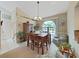 Bright dining room with a large arched window and seating for six at 2163 Rainbower Ct, Lakeland, FL 33810