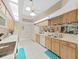 Open kitchen features a double sink and views to living area at 2163 Rainbower Ct, Lakeland, FL 33810