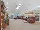 Relaxing living room featuring a sectional sofa and skylights at 2163 Rainbower Ct, Lakeland, FL 33810