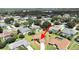 Aerial view showing a single-Gathering house with a driveway in a residential area at 2163 Rainbower Ct, Lakeland, FL 33810