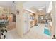 Galley style kitchen with white appliances and wood cabinets at 2163 Rainbower Ct, Lakeland, FL 33810
