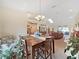 Open dining room with views to the living room and kitchen at 2163 Rainbower Ct, Lakeland, FL 33810