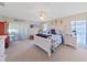 Bright bedroom featuring a large bed and ample natural light at 2163 Rainbower Ct, Lakeland, FL 33810