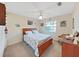 Bright bedroom with a double bed and wood furniture at 2163 Rainbower Ct, Lakeland, FL 33810