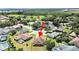 Aerial view showcasing a single-Gathering home with pool in a residential neighborhood at 2163 Rainbower Ct, Lakeland, FL 33810