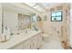 Clean bathroom with single sink vanity and shower/tub combo at 2163 Rainbower Ct, Lakeland, FL 33810