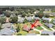 An aerial view of a house with a pool in a quiet residential neighborhood at 2163 Rainbower Ct, Lakeland, FL 33810
