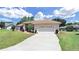 Single-story house with two-car garage and landscaping at 2163 Rainbower Ct, Lakeland, FL 33810