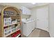 Laundry room with washer, dryer, and storage at 2163 Rainbower Ct, Lakeland, FL 33810