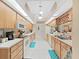 Long kitchen with lots of counter space and wood cabinets at 2163 Rainbower Ct, Lakeland, FL 33810