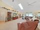 Spacious living room with large sectional sofa and high ceilings at 2163 Rainbower Ct, Lakeland, FL 33810