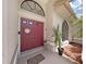 Double door entry with welcome mat and plants at 2163 Rainbower Ct, Lakeland, FL 33810