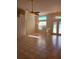 Sunlit living room with tile flooring and a ceiling fan at 6 Southern Trace Blvd, Ormond Beach, FL 32174