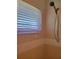 Shower stall with tiled walls and a handheld shower head at 6 Southern Trace Blvd, Ormond Beach, FL 32174