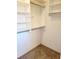 Large walk-in closet with shelves and hanging rods at 6 Southern Trace Blvd, Ormond Beach, FL 32174