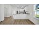 Modern kitchen with a breakfast bar and stainless steel appliances at 15271 Sw 65Th Terrace Rd, Ocala, FL 34473