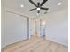 Spacious bedroom with hardwood floors, double closet and ensuite bathroom at 485 Adams View Ln, Auburndale, FL 33823