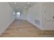 Spacious bedroom with light wood floors and multiple windows at 485 Adams View Ln, Auburndale, FL 33823