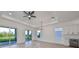 Spacious living area with hardwood floors, high ceilings, and access to patio at 485 Adams View Ln, Auburndale, FL 33823