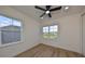 Bright bedroom with hardwood floors, large windows and ceiling fan at 485 Adams View Ln, Auburndale, FL 33823