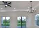 Bright living room with hardwood floors, high ceilings, and sliding glass doors at 485 Adams View Ln, Auburndale, FL 33823