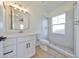 Bright bathroom features a walk-in shower, modern vanity, and updated fixtures at 485 Adams View Ln, Auburndale, FL 33823