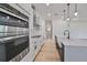 Bright kitchen with stainless steel appliances and white shaker cabinets at 485 Adams View Ln, Auburndale, FL 33823