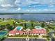 Community clubhouse with pool, tennis courts, and lake views at 485 Adams View Ln, Auburndale, FL 33823