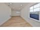Spacious bedroom with wood floors and multiple windows at 485 Adams View Ln, Auburndale, FL 33823