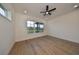 Spacious bedroom featuring light wood flooring and a ceiling fan at 485 Adams View Ln, Auburndale, FL 33823