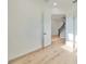 Spacious bedroom with hardwood floors and open doorway to hallway at 485 Adams View Ln, Auburndale, FL 33823