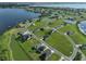Aerial view of luxury homes and community amenities near the lake at 485 Adams View Ln, Auburndale, FL 33823