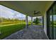 Relaxing covered patio overlooks a serene lake view at 485 Adams View Ln, Auburndale, FL 33823
