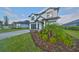 Two-story home with a gray brick driveway at 485 Adams View Ln, Auburndale, FL 33823