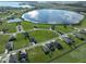 Aerial view of lakefront community with spacious homes and green spaces at 485 Adams View Ln, Auburndale, FL 33823