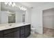 Double vanity bathroom with a large mirror and a walk-in shower at 468 Waterford Dr, Lake Alfred, FL 33850