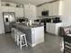 Modern kitchen with large island and stainless steel appliances at 6945 Church Lake St, Groveland, FL 34736
