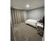 Simple bedroom with carpeted floor and a single bed at 6945 Church Lake St, Groveland, FL 34736