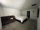 Relaxing bedroom with plush carpet and a comfortable bed at 6945 Church Lake St, Groveland, FL 34736