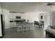 Open concept kitchen with island and stainless steel appliances at 6945 Church Lake St, Groveland, FL 34736