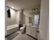 Clean bathroom with a bathtub, toilet, and vanity at 1564 Eucalyptus Way, Davenport, FL 33837