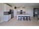 Kitchen with island, stainless steel appliances, and granite countertops at 1564 Eucalyptus Way, Davenport, FL 33837