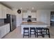 Kitchen with island, stainless steel appliances, and granite countertops at 1564 Eucalyptus Way, Davenport, FL 33837