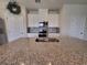 Kitchen with granite countertop and stainless steel sink at 1564 Eucalyptus Way, Davenport, FL 33837