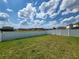 Spacious backyard with a white vinyl fence at 1564 Eucalyptus Way, Davenport, FL 33837
