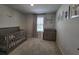 Bright Bedroom features a crib, dresser, and window with blinds at 1564 Eucalyptus Way, Davenport, FL 33837
