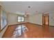 Spacious living room featuring wood flooring and large windows at 220 Coleman E Dr, Winter Haven, FL 33884