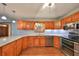 Modern kitchen featuring stainless steel appliances and granite countertops at 220 Coleman E Dr, Winter Haven, FL 33884
